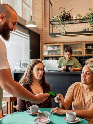 Customer making payment with credit card on card machine