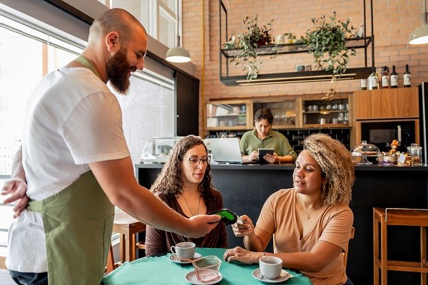 Customer making payment with credit card on card machine