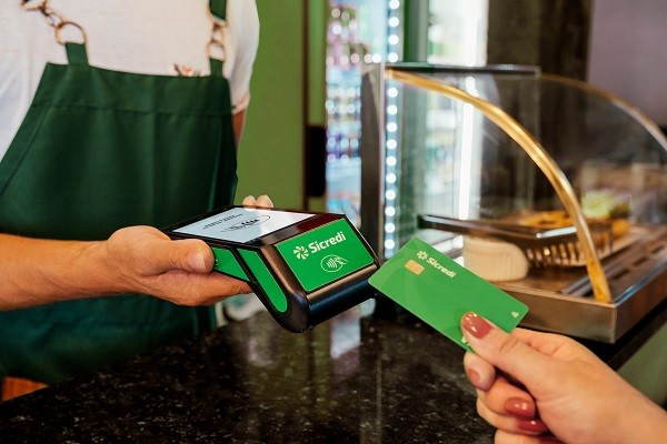 Manager receiving the payment, in a cafeteria