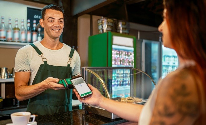 Manager receiving the payment, in a cafeteria